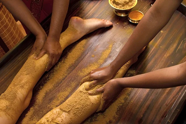 Udhwarthanam Ayurvedic herbal powder massage therapy